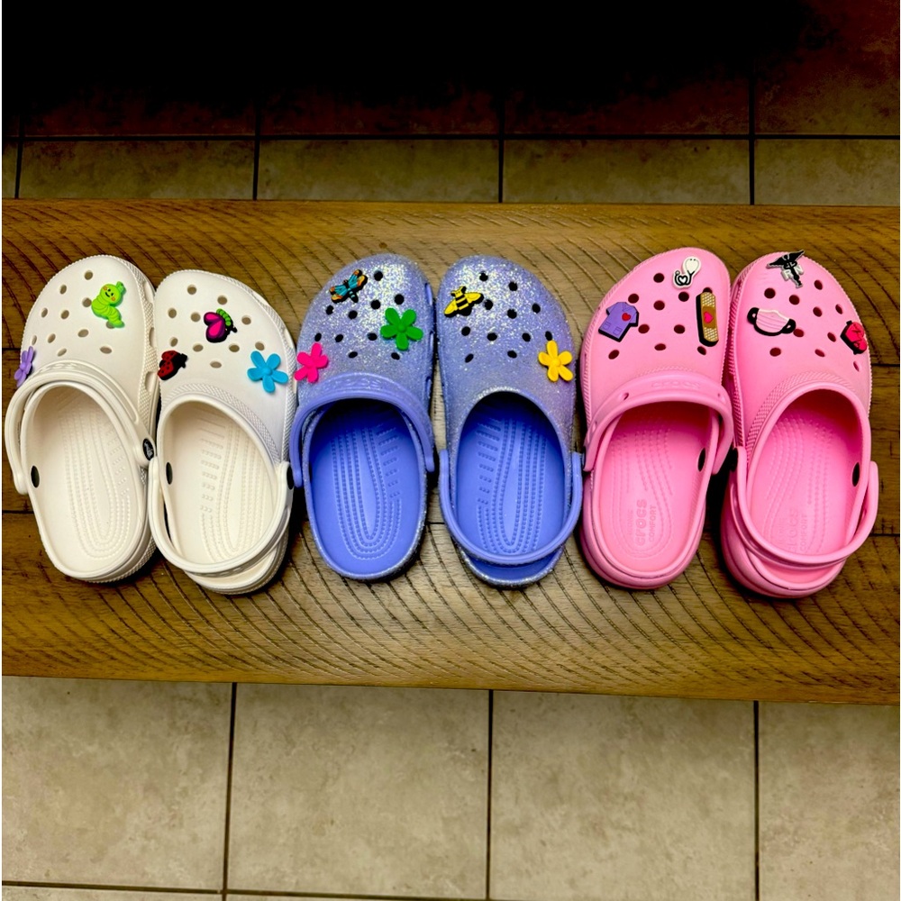 Brand new Crocs. Size 6. White, purple and pink. $70 for all or $25 apiece